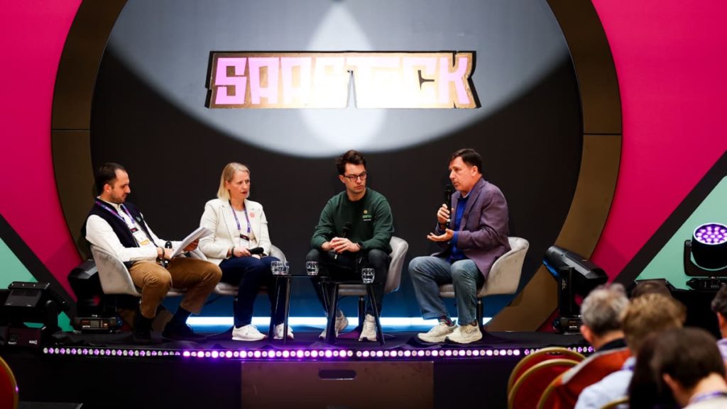 James Gill speaking on the SaaS for Good panel at SaaStock 2025 with George, Kirstie, and Joe.